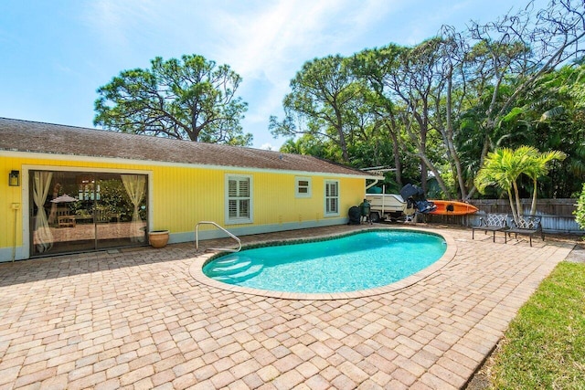 903 Oak Cir, Jupiter, FL 33458 - view of swimming pool featuring a patio area and fence