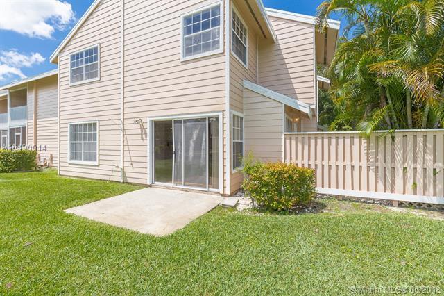 2167 Champions Way N, Lauderdale, FL 33068 - rear view of house with a patio area