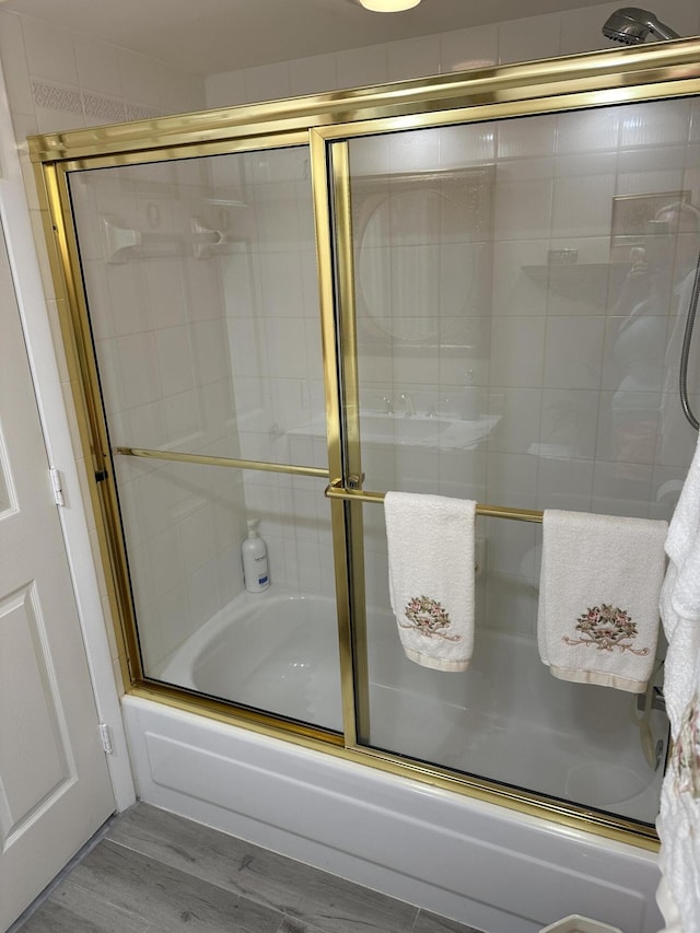 17287 Boca Club 1 Blvd Unit 1, Boca Raton, FL 33487 - full bathroom with bath / shower combo with glass door and wood finished floors