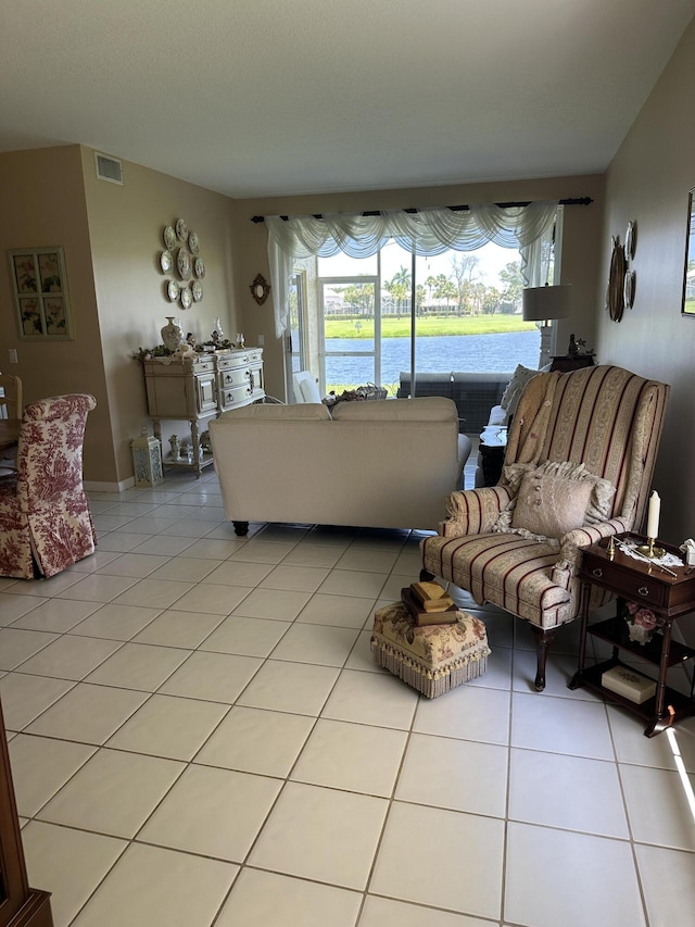 17287 Boca Club 1 Blvd Unit 1, Boca Raton, FL 33487 - living area with light tile patterned flooring and a water view