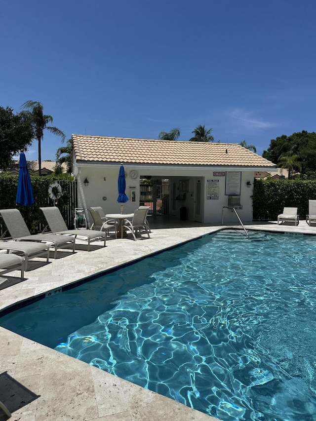 17287 Boca Club 1 Blvd Unit 1, Boca Raton, FL 33487 - community pool featuring a patio area