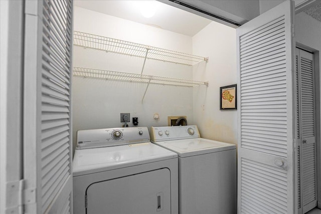 washroom featuring washer and clothes dryer
