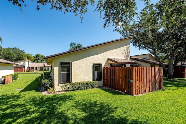 back of house with stucco siding