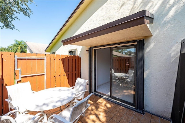 view of patio / terrace featuring fence