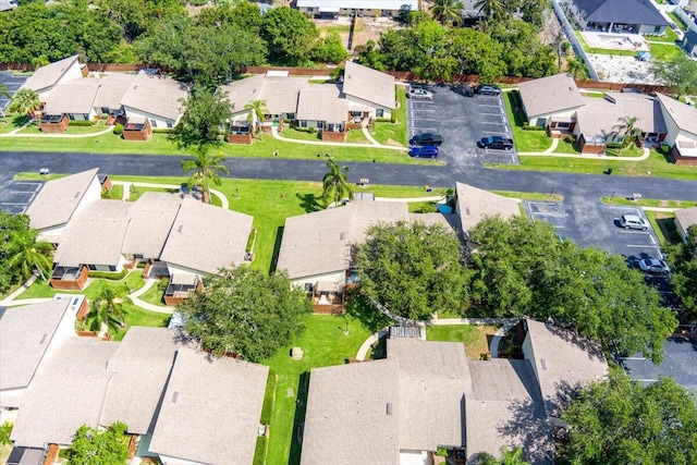 aerial view of property and surrounding area featuring nearby suburban area