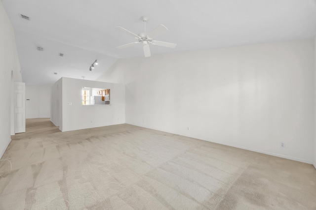 unfurnished living room featuring lofted ceiling, light carpet, and a ceiling fan