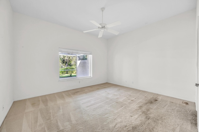 spare room featuring carpet floors and ceiling fan