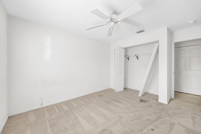 unfurnished bedroom featuring carpet floors, ceiling fan, and baseboards