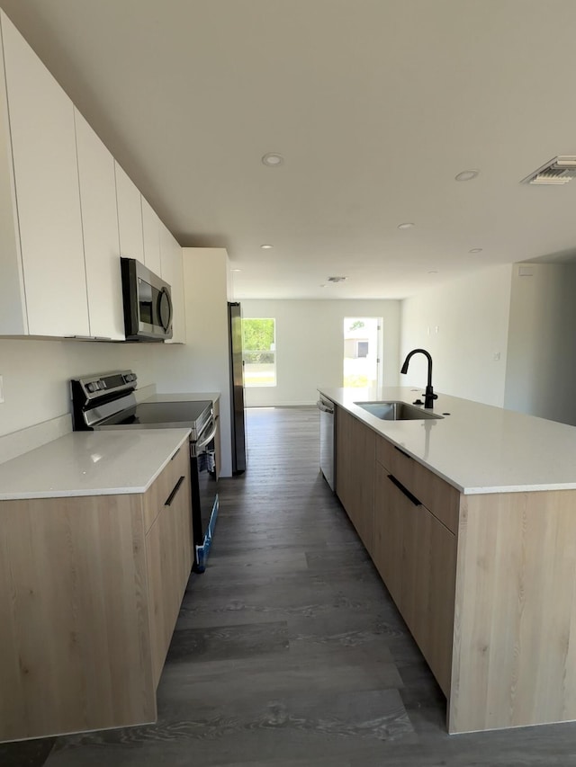 382 Mcarthur Blvd, Lehigh Acres, FL 33974 - kitchen with a sink, stainless steel appliances, modern cabinets, dark wood-style flooring, and a large island