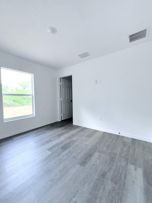 382 Mcarthur Blvd, Lehigh Acres, FL 33974 - spare room with wood finished floors and baseboards