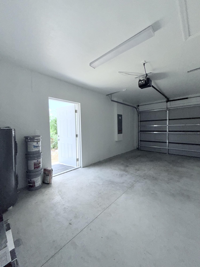 382 Mcarthur Blvd, Lehigh Acres, FL 33974 - garage featuring a garage door opener and electric panel