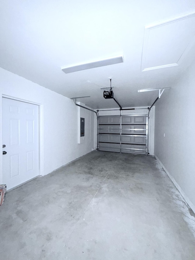 382 Mcarthur Blvd, Lehigh Acres, FL 33974 - garage featuring electric panel and a garage door opener