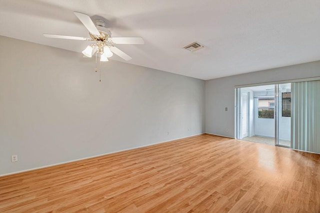 spare room with light wood-style flooring and a ceiling fan