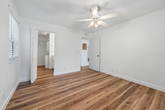 12416 Alternate A1A P7, Palm Beach Gardens, FL 33410 - unfurnished bedroom featuring wood finished floors, a closet, and baseboards