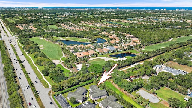 12416 Alternate A1A P7, Palm Beach Gardens, FL 33410 - aerial view of property and surrounding area with a large body of water, a major roadway, a golf course, and nearby suburban area