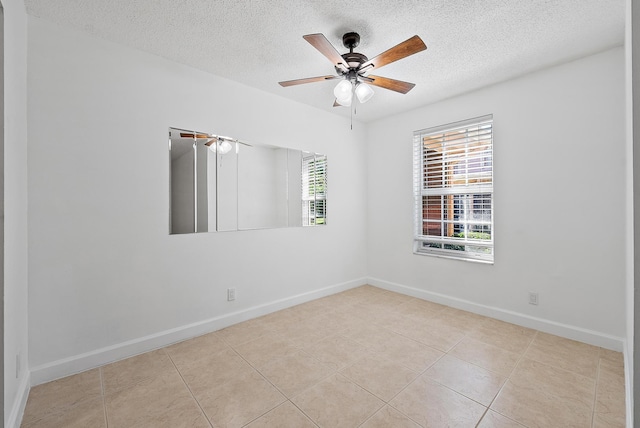 12416 Alternate A1A P7, Palm Beach Gardens, FL 33410 - tiled empty room with a textured ceiling, baseboards, and ceiling fan
