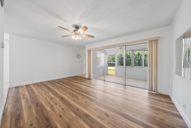 12416 Alternate A1A P7, Palm Beach Gardens, FL 33410 - spare room featuring ceiling fan, a textured ceiling, wood finished floors, and baseboards