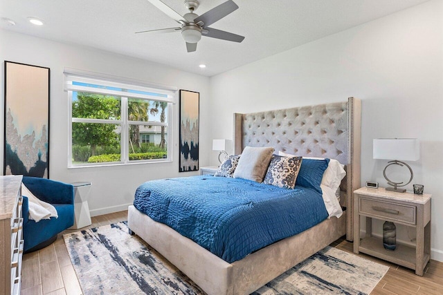 7030 Peters Ln, Delray Beach, FL 33446 - bedroom with light wood-style floors, baseboards, a ceiling fan, and recessed lighting