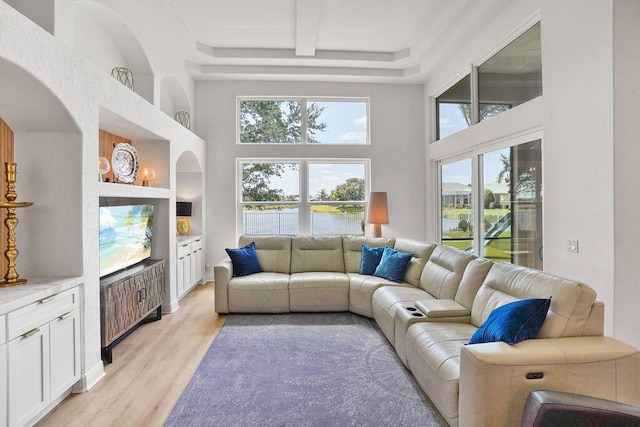138 NW Magnolia Lakes Blvd, Port Saint Lucie, FL 34986 - living area featuring a towering ceiling and light wood finished floors