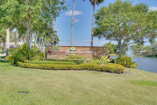 138 NW Magnolia Lakes Blvd, Port Saint Lucie, FL 34986 - community sign featuring a water view and a lawn