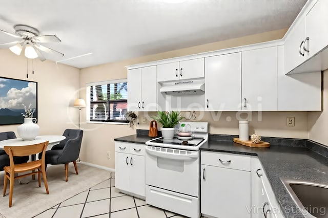 kitchen featuring white electric range oven, under cabinet range hood, a ceiling fan, dark countertops, and white cabinetry