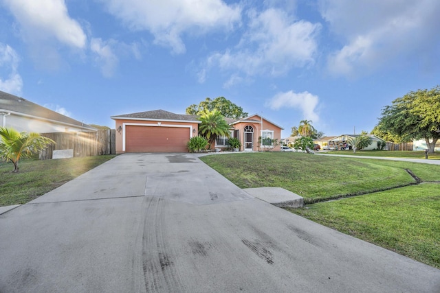 201 NW Virgo Ct, Port Saint Lucie, FL 34983 - view of front of house featuring driveway, an attached garage, and stucco siding