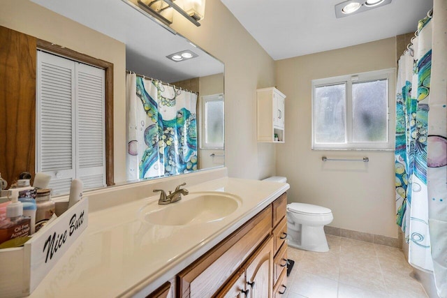 4901 129th Ave N, The Acreage, FL 33411 - full bathroom with tile patterned floors, vanity, baseboards, and toilet