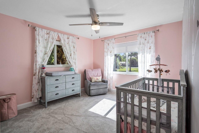 4901 129th Ave N, The Acreage, FL 33411 - bedroom with carpet flooring, a nursery area, a ceiling fan, and baseboards