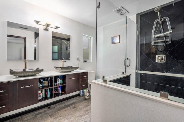 4901 129th Ave N, The Acreage, FL 33411 - full bath featuring a shower stall, wood finished floors, and double vanity