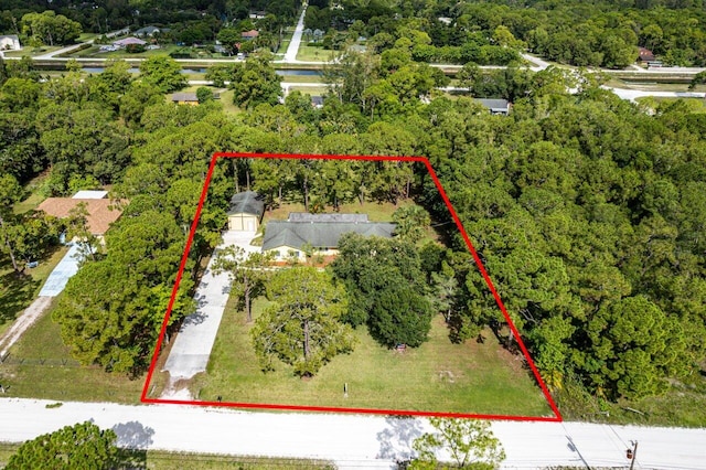 4901 129th Ave N, The Acreage, FL 33411 - aerial overview of property's location featuring property parcel outlined and a forest