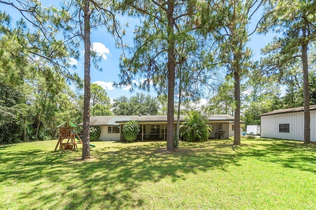 4901 129th Ave N, The Acreage, FL 33411 - view of front of property featuring a playground and a front yard
