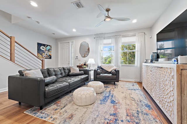 1310 S Jeaga Dr, Jupiter, FL 33458 - living room with wood finished floors, recessed lighting, a ceiling fan, stairs, and baseboards