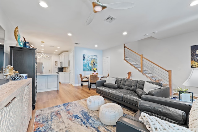 1310 S Jeaga Dr, Jupiter, FL 33458 - living room with stairs, light wood-type flooring, recessed lighting, and ceiling fan