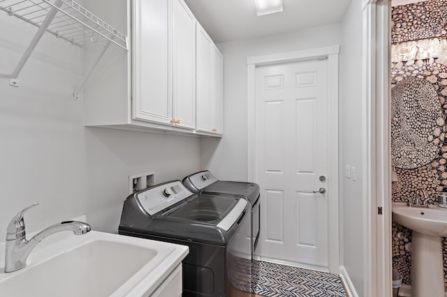1310 S Jeaga Dr, Jupiter, FL 33458 - laundry area with washer and dryer and cabinet space