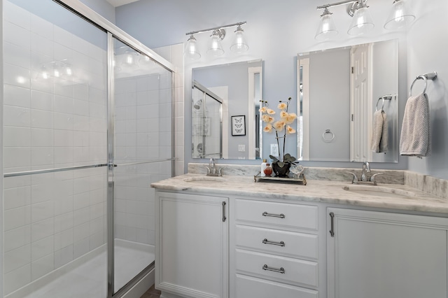 1310 S Jeaga Dr, Jupiter, FL 33458 - bathroom with a shower stall and double vanity