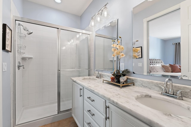 1310 S Jeaga Dr, Jupiter, FL 33458 - full bathroom featuring ensuite bath, double vanity, a stall shower, and tile patterned floors