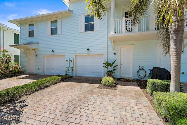 1310 S Jeaga Dr, Jupiter, FL 33458 - townhome / multi-family property featuring decorative driveway and an attached garage