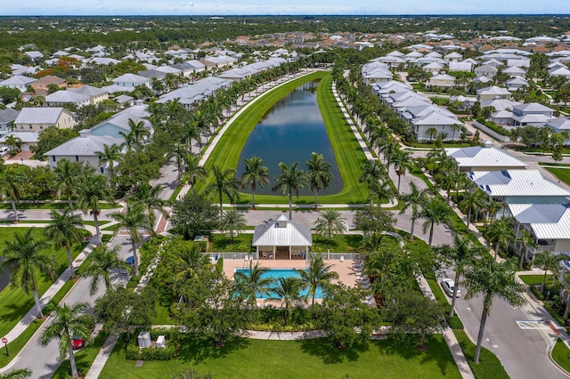 1310 S Jeaga Dr, Jupiter, FL 33458 - aerial view of property and surrounding area featuring a large body of water, nearby suburban area, and a pool area