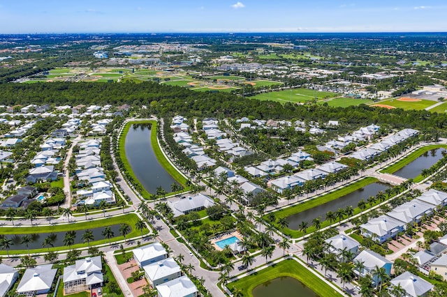 1310 S Jeaga Dr, Jupiter, FL 33458 - aerial view of property and surrounding area with a large body of water and nearby suburban area