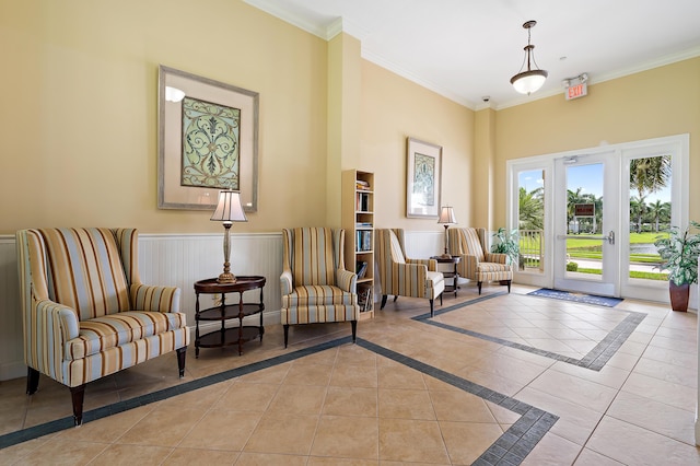 1310 S Jeaga Dr, Jupiter, FL 33458 - sitting room with crown molding, a wainscoted wall, and light tile patterned floors
