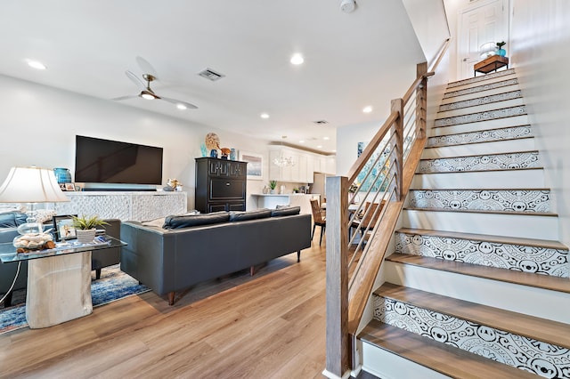 1310 S Jeaga Dr, Jupiter, FL 33458 - living room with stairs, light wood-style floors, a ceiling fan, and recessed lighting