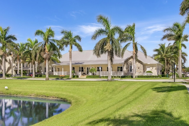 1310 S Jeaga Dr, Jupiter, FL 33458 - view of home's community featuring a lawn and a water view
