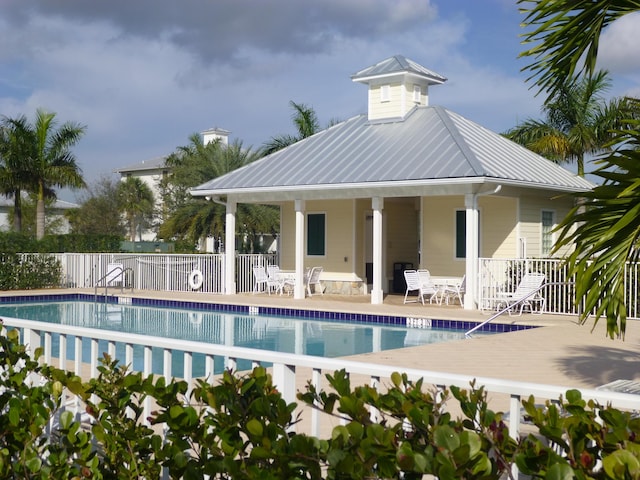 1310 S Jeaga Dr, Jupiter, FL 33458 - community pool featuring a patio