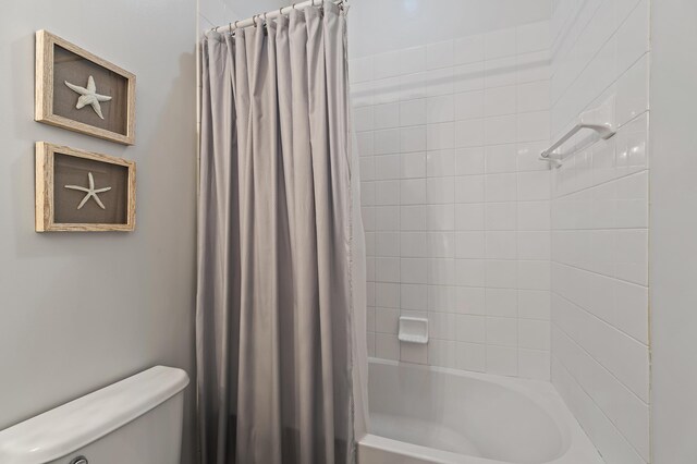 1310 S Jeaga Dr, Jupiter, FL 33458 - bathroom featuring toilet and shower / tub combo