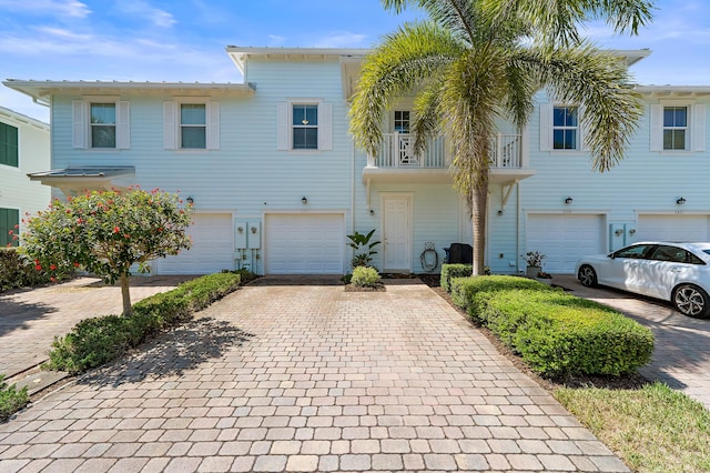 1310 S Jeaga Dr, Jupiter, FL 33458 - view of property featuring driveway and a garage