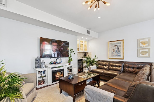 310 Almeria Rd, West Palm Beach, FL 33405 - living room featuring a glass covered fireplace, a chandelier, and recessed lighting