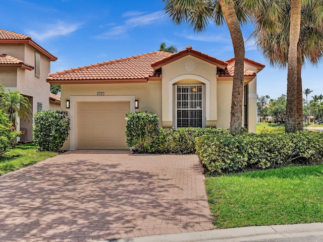 6382 NW 38th Dr, Coral Springs, FL 33067 - mediterranean / spanish-style home featuring a garage, decorative driveway, a tile roof, and stucco siding