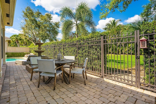 2068 Wightman Dr, Wellington, FL 33414 - view of patio featuring fence and a gate