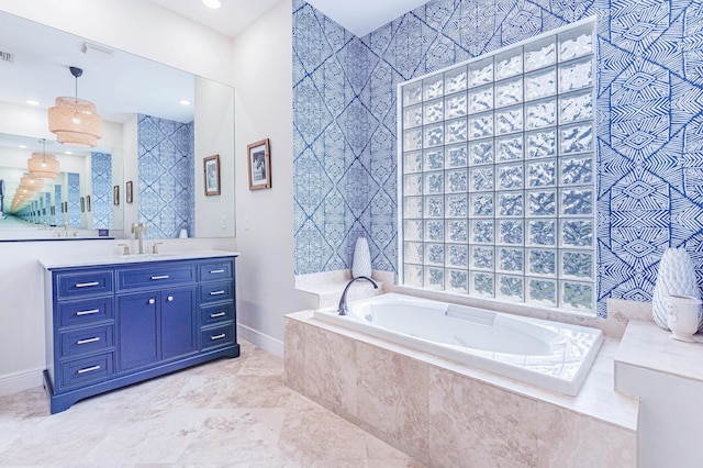 2068 Wightman Dr, Wellington, FL 33414 - full bath with a garden tub, baseboards, vanity, and recessed lighting