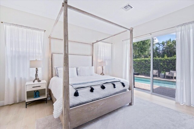 2068 Wightman Dr, Wellington, FL 33414 - bedroom with access to outside and wood finished floors
